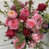Bouquet of pink and red roses with eucalyptus