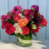 Mixed bouquet of roses and hydrangeas in a glass vase