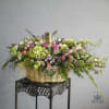 Large basket arrangement with pink roses and mixed blooms