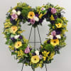 Heart-shaped floral wreath with yellow gerberas, lavender roses, and white roses