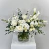 Discover the timeless elegance of Purity, a luxurious all-white flower arrangement from