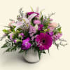 Pink and white mixed flower arrangement in a white textured vase