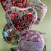 Cluster of birthday and love-themed foil balloons