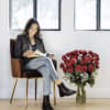 A dozen or more long premium roses are in the classy glass