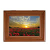 Wooden framed memorial plaque with a poppy field and sunset quote