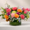 Colorful mixed flower arrangement in a glass vase