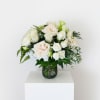 A serene cluster of white and very pale peach blooms makes a