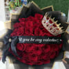 long stem red roses wrapped in our black with gold flower paper
