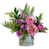 A beautiful petite arrangement in shades of pinks, lavender and yellow featuring