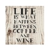 Wooden sign with the words "Life is what happens between coffee and wine"