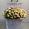 Large bouquet of cream spray roses in a white gift box