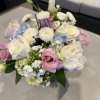 Bouquet of white, pink, and blue flowers in a vase