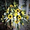Yellow sunflower arrangement with white flowers and ribbon streamers
