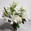 Graceful, serene, and timeless- Ivory Embrace is a breathtaking all white arrangement