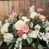 Pastel rose arrangement with white and pink blooms in a low design