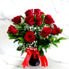 A timeless arrangement of fresh red roses accented with delicate baby&rsquo;s breath