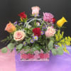 A bright, giftable presentation of mixed-color roses that reads like a bouquet