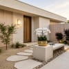 White orchid arrangement in a gold bowl on a modern outdoor bench