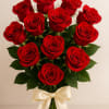 Bouquet of red roses tied with a cream ribbon
