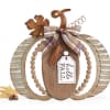 Decorative wooden pumpkin sign with plaid bow and hello fall tag