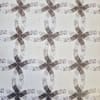 Patterned fabric with interlocking oval and bow shapes in muted brown and gray