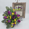 Soft purple silk tulips and a warm rustic wood frame set a