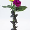 Vivid purple carnations and cheerful yellow daisy-like blooms create an eye-catching flower