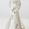 White ceramic angel figurine with cutout details