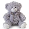 Lavender plush teddy bear with a plaid ribbon bow