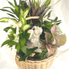 A woven sympathy garden basket of mixed foliage brings a quiet, comforting
