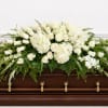 A large, all-white casket spray that reads as quietly majestic-Heavenly Casket Spray