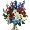 A dramatic upright arrangement that speaks with bold color and quiet dignity