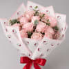 Pink rose bouquet wrapped in Hello Kitty paper with a red ribbon