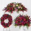 A vivid, multi-piece floral bundle that reads like a comforting sympathy and