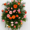 A tall, ceremonial spray that greets the room with a warm, uplifting