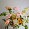 Spring Serenade
A gentle symphony of soft peach and blush pink blooms, this