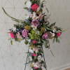 Our Cross Shape Easel is fully customizable in colors and flowers. Cross