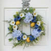 Measures 20&rdquo; in diameter. Made of all faux flowers in blue, white