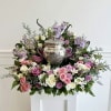 A beautiful mix of soft pastel flowers, high in the back and