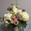 Bouquet with white hydrangeas and pink rose accents. 