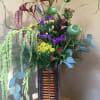 This unique design features green and red Hanging Amaranthus, Hypericums, papaver (somniferum)