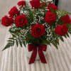 A classic and elegant arrangement of a dozen premium red roses in