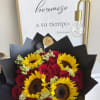 Bouquet of red roses and yellow sunflowers wrapped in black paper