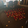 A collection of candles and red roses can do all the talking