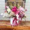 Premium peonies in combination with light pink and hot pink delight flowers.