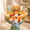 Bouquet of orange and white roses with a teddy bear and Happy Birthday topper