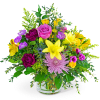 Colorful mixed bouquet in a clear glass vase