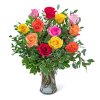 Mixed-color roses arranged in a clear glass vase