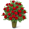 Red roses arranged in a clear glass vase