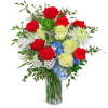 Bouquet of red and pale yellow roses with white lilies in a glass vase